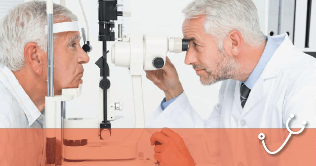 Ophthalmologist performing a slit-lamp eye exam on an elderly man in a clinic setting.