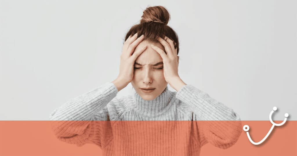 Anxious woman holds her head with both hands, indicating stress, with a medical-themed overlay at the bottom.